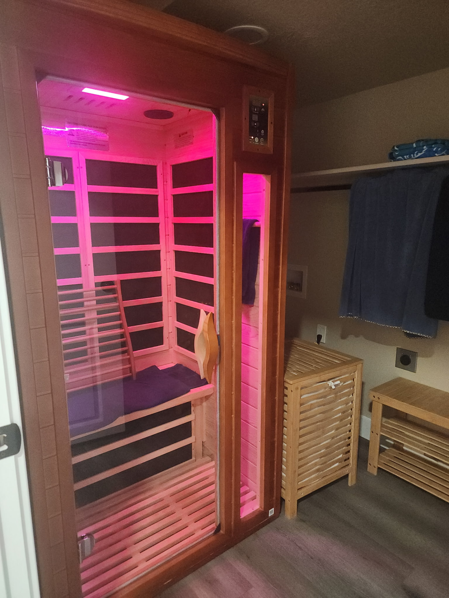 Cedar low EMF far infrared sauna glowing with chromotherapy light
